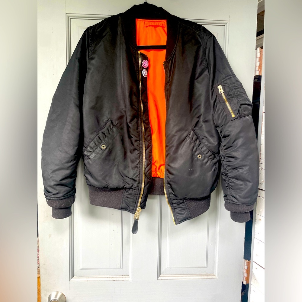 Alpha industries size medium women’s bomber jacket.